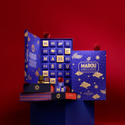 Advent calendar box with blue window of numbered chocolate squares and panels