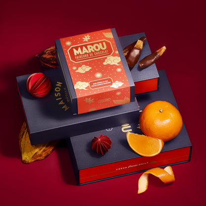 Chocolate candied mandarin gift box with chocolate pieces and mandarin fruits