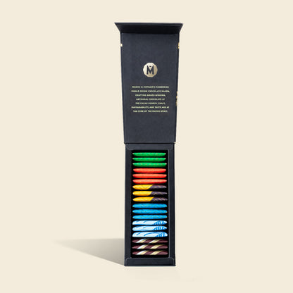 Opened chocolate gift box showing 18 colorful napolitains in individual wrappers