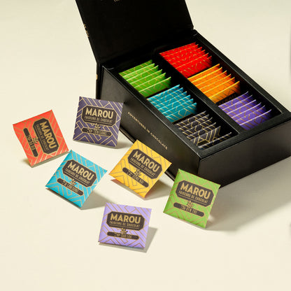 Opened chocolate gift box tray with assorted colorful Marou napolitains pieces