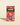 Marou chocolate bar package, red wrapper with Marou logo and seal graphic